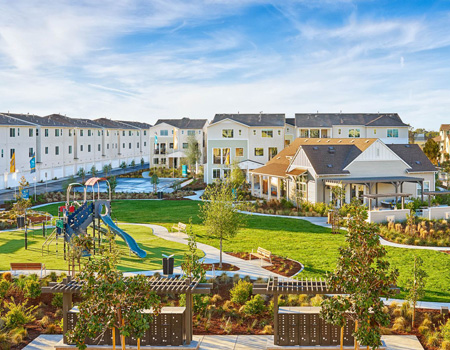 Exterior shot of the Bayshores Association showing the playground and clubhouse.